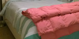I like to pretend that the pink down comforter at the foot of my bed is just there for decoration, but really, I pull it up to my chin every night.